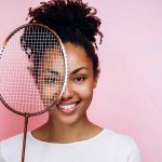 Playful girl holding tennis racquet – © Maples Images - shutterstock.com - 1800058918